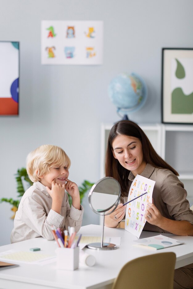 woman-doing-speech-therapy-with-little-boy-her-clinic