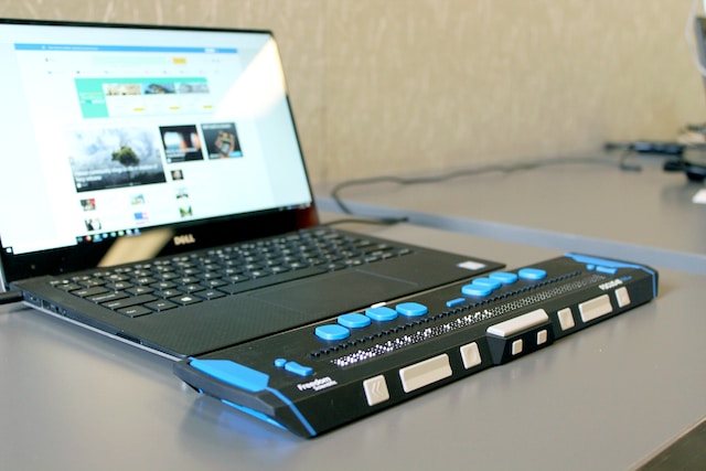 An accessibility device attached to a laptop